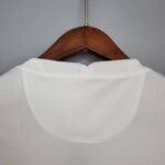 camiseta psg blanca y rosa cuello