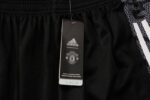 Pantalón de Chándal Manchester United 2122 etiqueta
