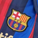 Body Barcelona primera equipación 2022-2023 - escudo