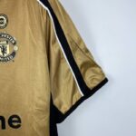 camiseta manchester united 2001 dorada manga