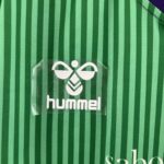camiseta málaga 23 24 logo hummel