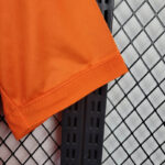 camiseta-real-madrid-naranja-manga