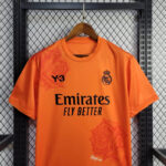 camiseta-real-madrid-naranja-pecho