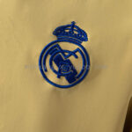 cortaviento-real-madrid-reversible-azul-y-amarillo-2025-2026-escudo