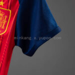 body-de-bebe-españa-primera-equipacion-mundial-2026-puño